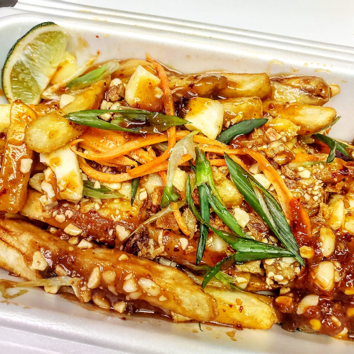 bamboohutsylvan's tweet photo. Introducing our Spicy Pad Thai Poutine now available for take-out! Using sweet, spicy, salty, and tangy flavours, we celebrate our Canadian and Asian heritage together! #padthai #poutine #openfortakeout #bamboohut #sylvanlake #reddeer https://t.co/XetIEIx44Z