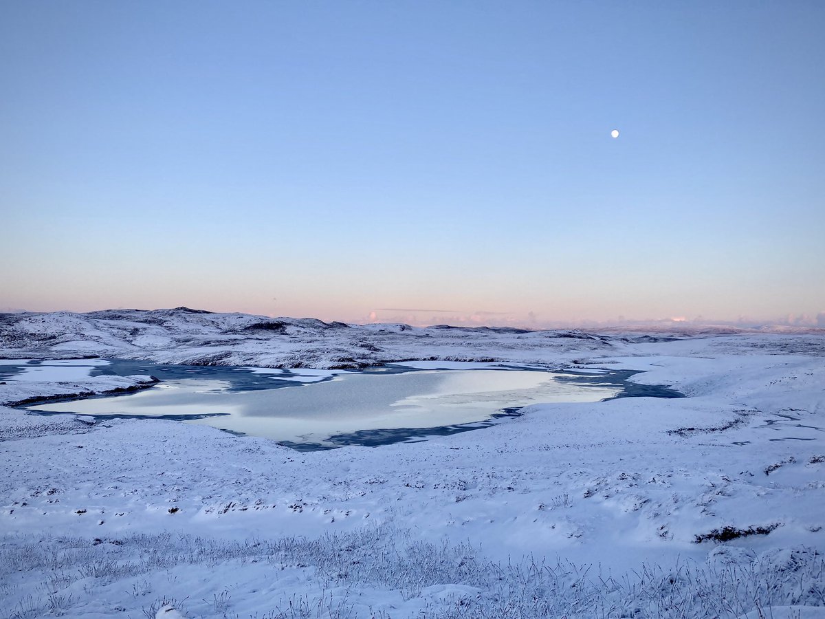 The drive back - sun setting at 3.30am, and that glorious pastel fade in the sky, a bright moon nearly full. Another loch fae the Sandness road, frozen over.