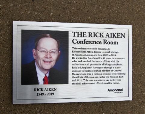 impactsigns1's tweet photo. Many who visit @amphenolaao's updated manufacturing facility in Sydney, NY are bound to be greeted with this conference room dedication plaque honoring Rick Aiken. We are honored to have made that possible. #signs #signsoftwitter https://t.co/HXy08hVL0W