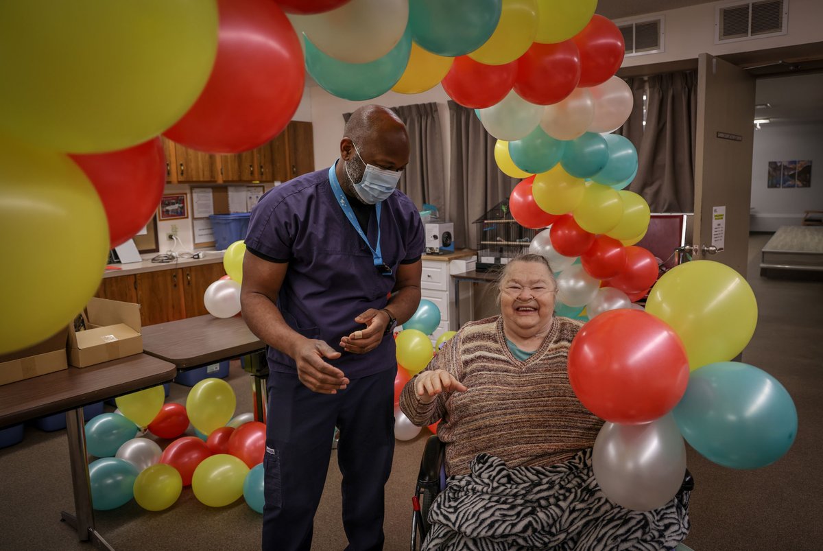 AHS_media's tweet photo. Joyce Adams has reason to celebrate—the 78-year-old Clifton Manor resident received her second dose of the #CovidVaccine this week. She shared a moment of joy with RN Emile Enongene, Director of Nursing at the manor. #ShotofHope https://t.co/W9FsjdkNEs