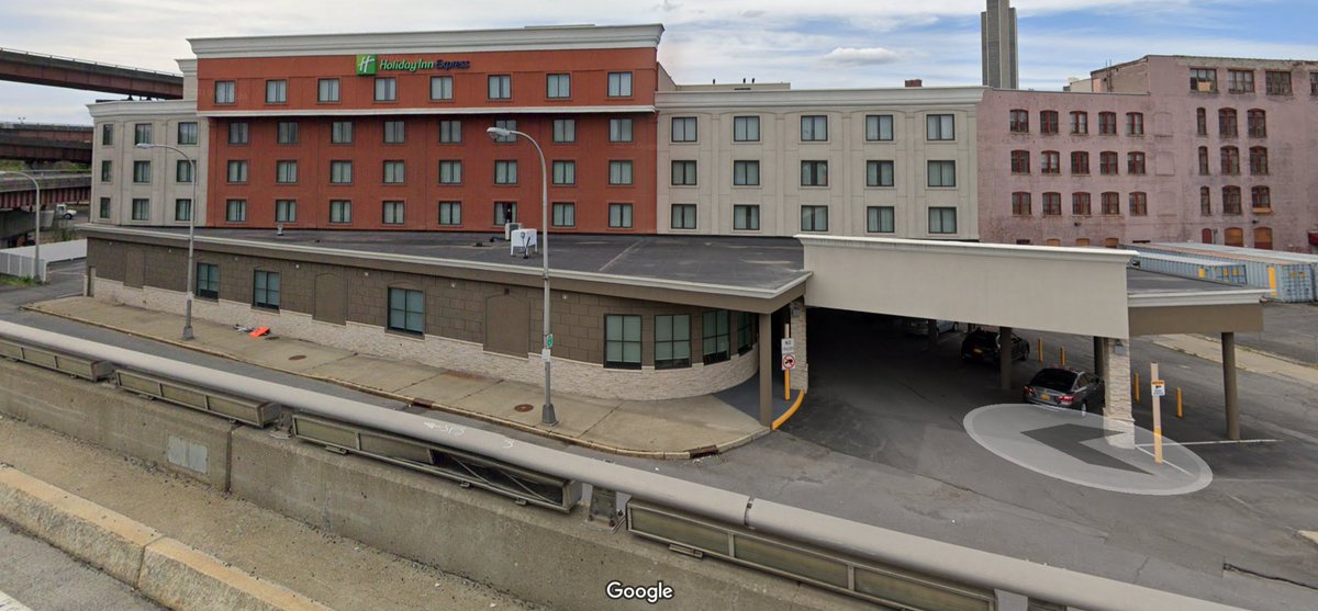 Sadly, Street View only goes back to 2009. NOT FAR ENOUGH. So instead, I'll share the current street view from the onramp. As you can see, THEY ARE THE SAME HEIGHT. The pool was behind that tan concrete ... arch? facade?