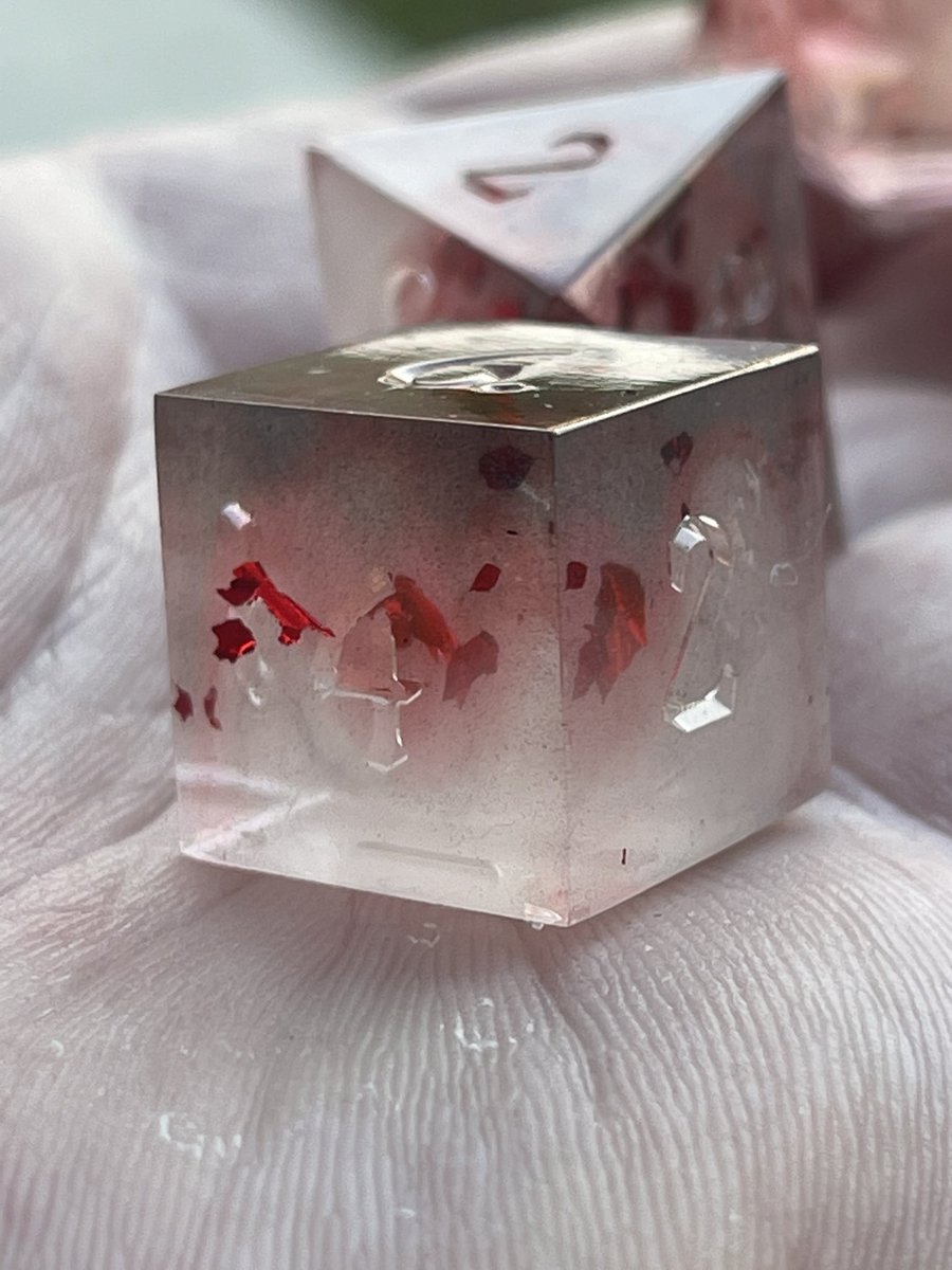 AlkeshOne's tweet photo. Latest pull from my @WerpyDice molds. A bit of black mica, a bit of white alcohol ink, white mica powder, and a bunch of metallic red leaf. WIP
#resindice #handmadedice #resin #dice #dicegoblin #dnd #dnddiceset #dnddice #diceset #polyhedradice #resinart #dicemaking #tabletopdice https://t.co/OMEiK4nn5f