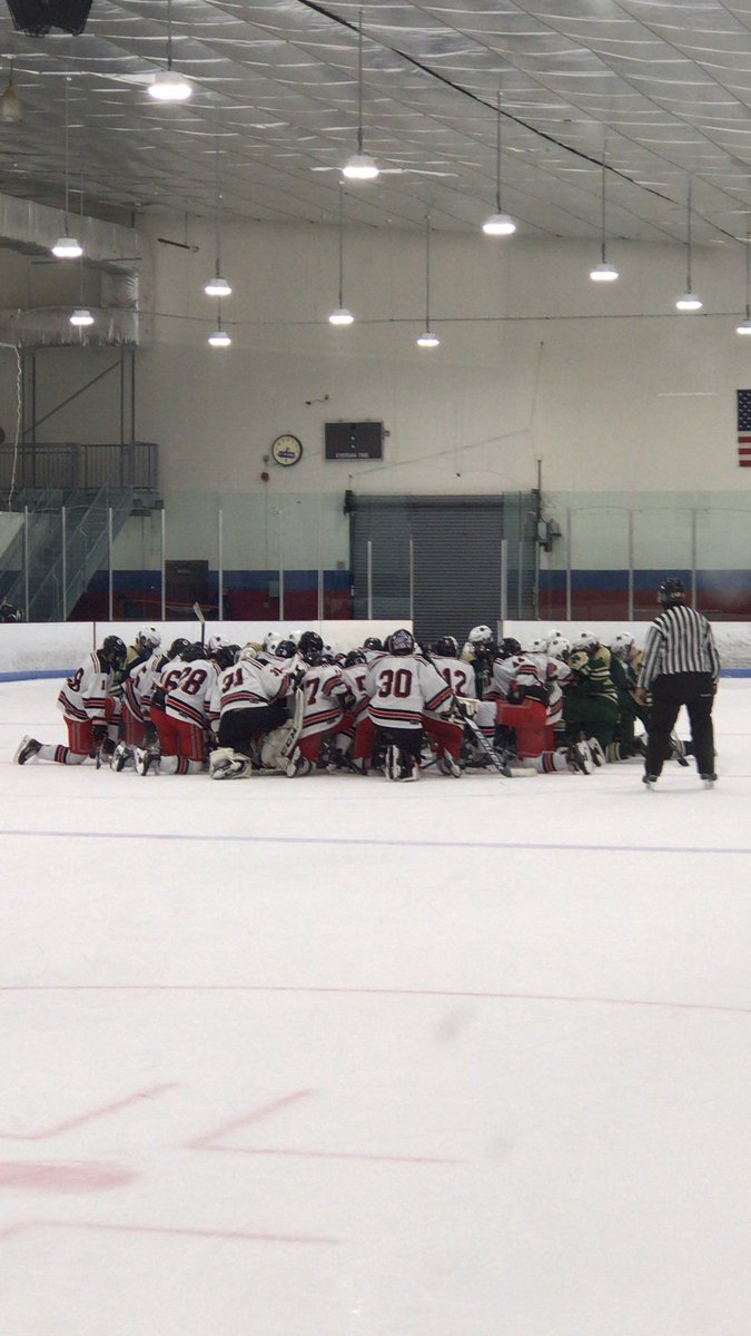 Jason_Kates's tweet photo. A great show of sportsmanship as both teams gather at center ice for the Bishop Feehan player who left due to injury. https://t.co/rN3RyANayr