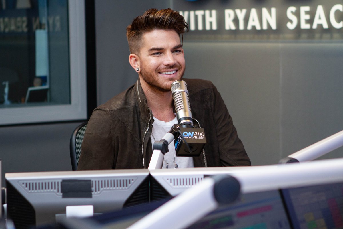 RyanSeacrest's tweet photo. Excited to catch up with our favorite rock star @adamlambert! There's a lot to celebrate, including an early birthday. Join us tomorrow morning at 9:25a PT: https://t.co/WfW8OXF2ld 

#AdamLambertOnSeacrest https://t.co/yj2k8AbfJf