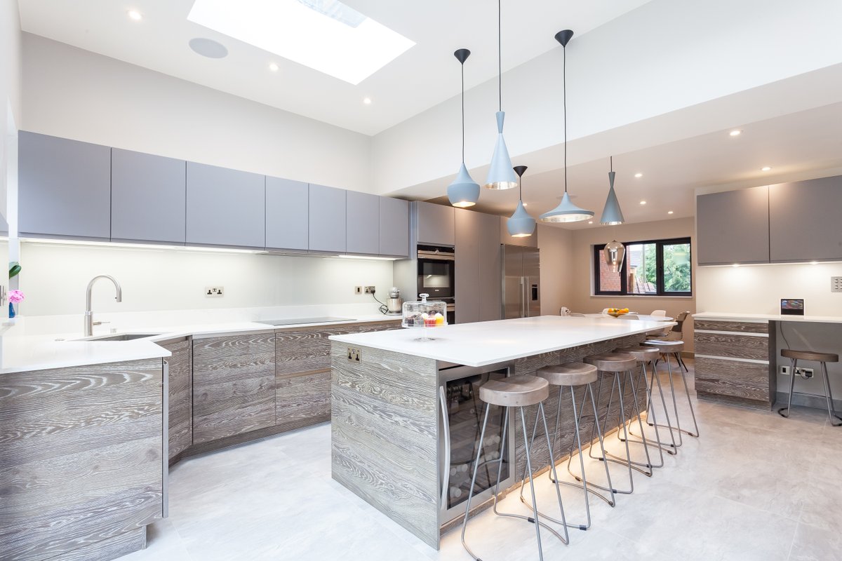 One Bookmatched Veneer and velvet lacquer kitchen with Caesarstone Worksurface - Kitchen Co-Ordination create THE most beautiful spaces #kitchens #kitchendesign #kitchenisland #interiordesigner #interiordecor #interiordesignideas