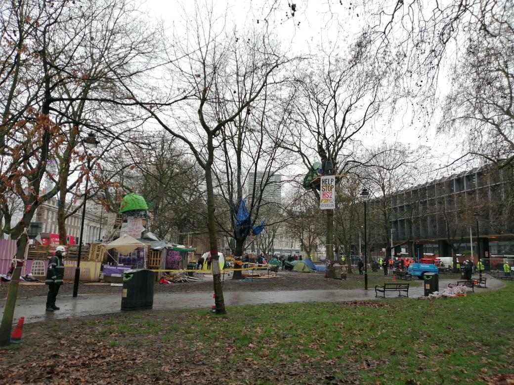 This is the scene from the Gardens right now.Lots of shouting going on from the trees.A tent of some kind has been erected by either bailiffs or police.