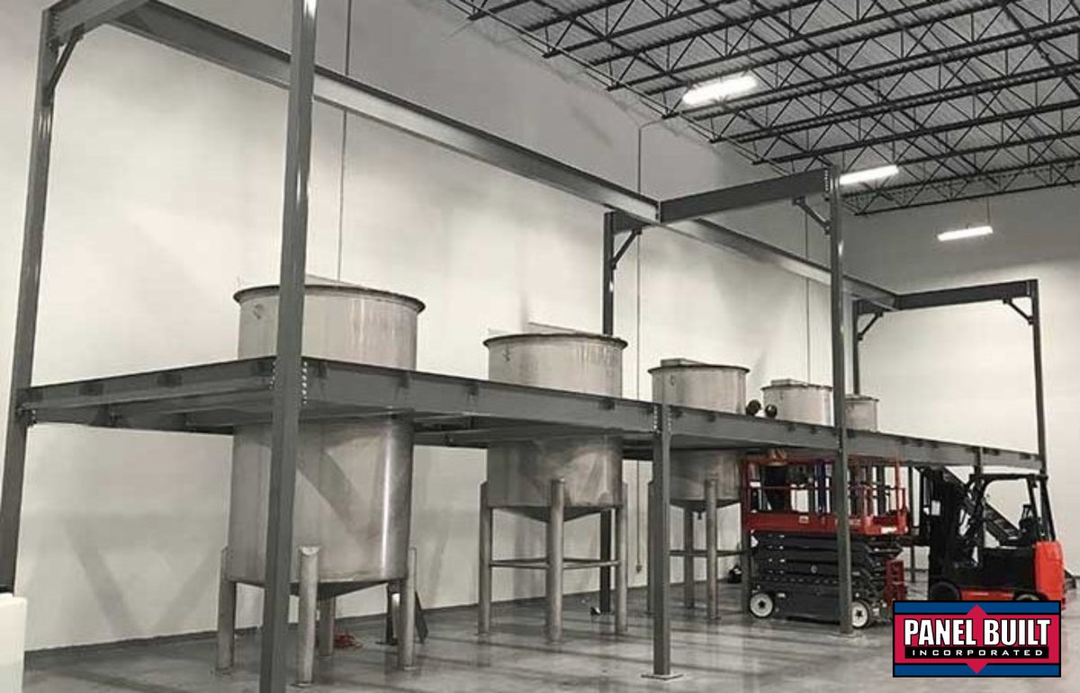 Tank platforms can vary significantly from project to project depending on the size, shape, and purpose of the tank. In this example the platform includes an overhead gantry that allows for a trolley system to easily transport their ingredients to each of the tanks.