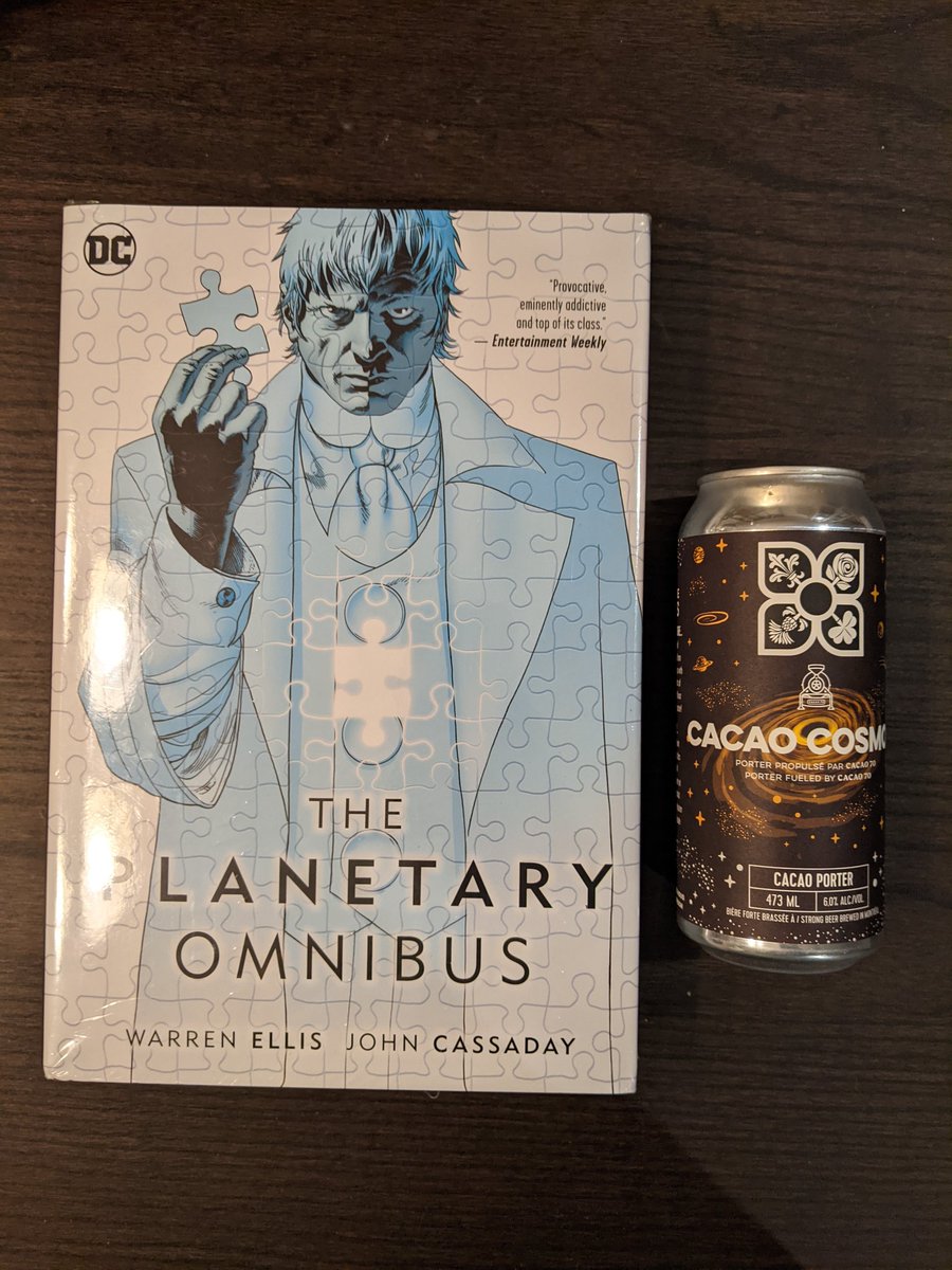Friends, it's official. I've now added my first proper thick hardcover omnibus to the collection. I evolved to a new level. I hope this is the last one 🤣
Also drinking "cacao-cosmos" today which I figured was appropriate. Nice local microbrew cacao bean porter <a href="/4originesbeer/">Microbrasserie 4 Origines</a>
