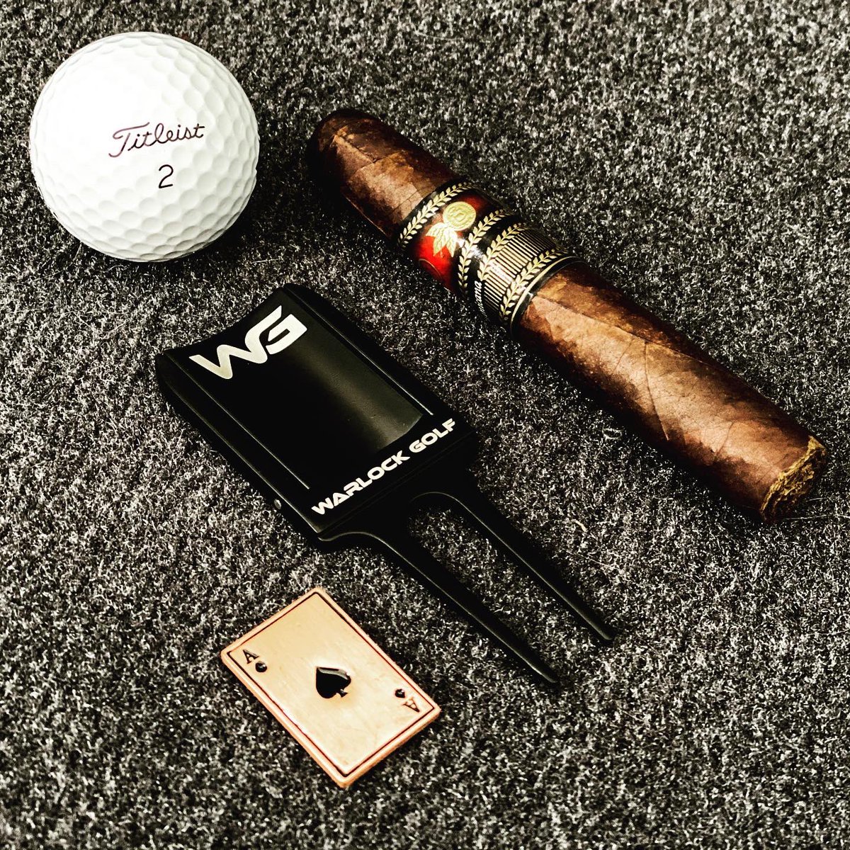 warlockgolf's tweet photo. Life is short, take the trip, eat the cake and smoke the cigar. New divot tools are here. Check them out on https://t.co/hs0Pobbh78 and use code warlockgolf15 for 15% off. #divottool #divottools #cigarlifestyle #cigarlife #cigarenthusiast https://t.co/EsJmeqD26v