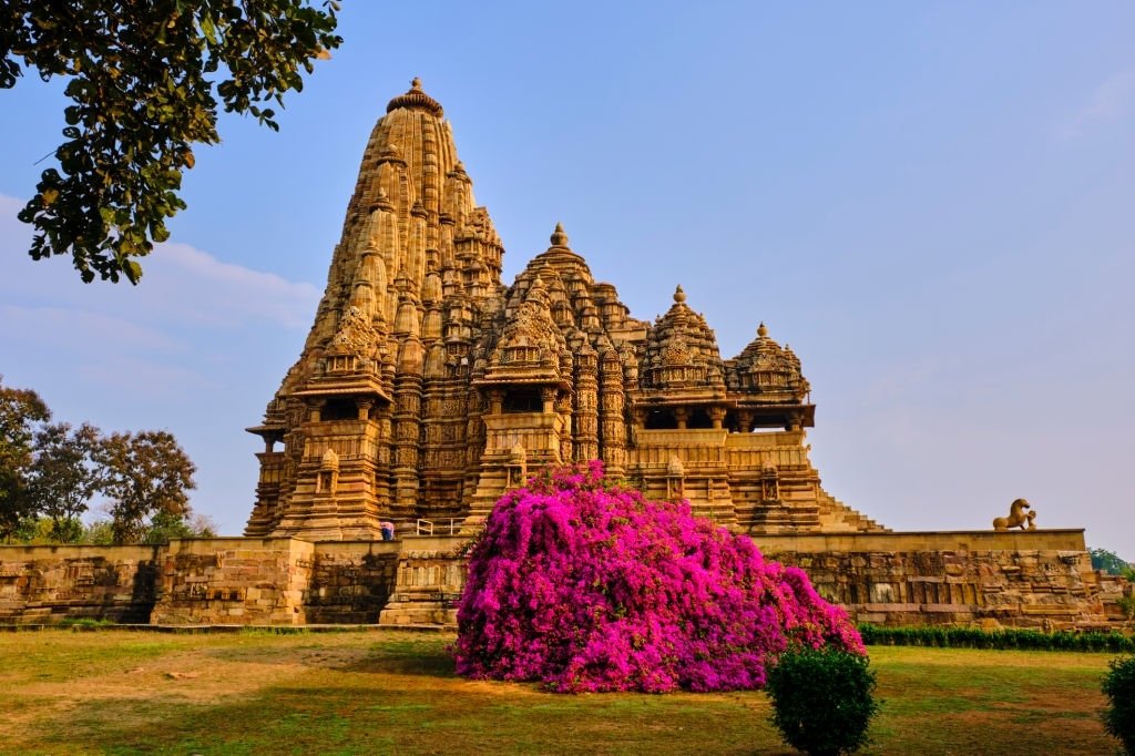 The Kandariya Mahadeva Temple is about 31 metres in height, The temple architecture is an assemblage of porches and towers which terminates in a shikhara or spire, an architectural feature which was common during 10th century onwards.