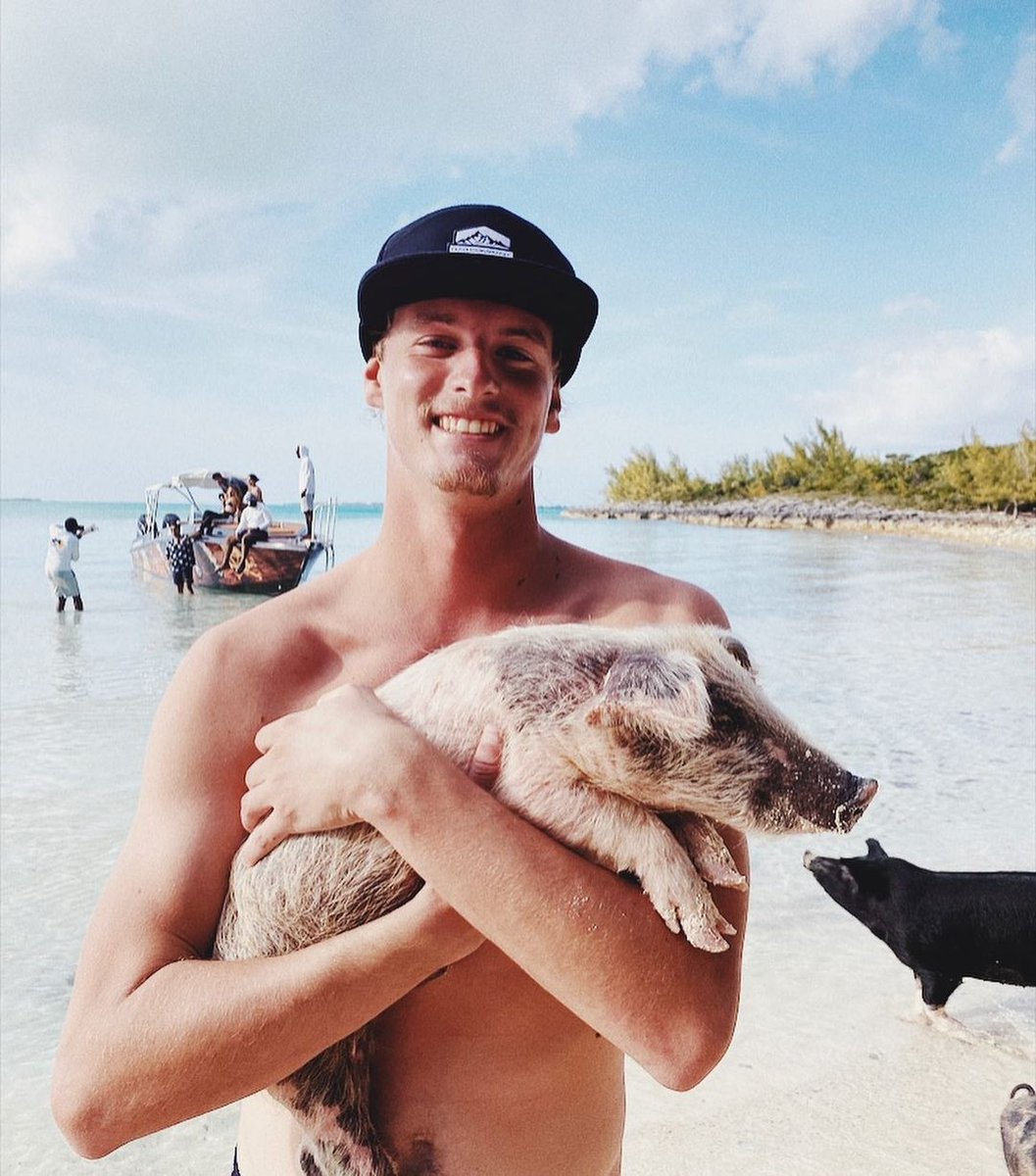 🏝️ Taylor Ohntrup kickin it with his piglet on the beach! 🐷 #radmvmnt #radcompany #pigbeach #exuma #bahamas #swimmingwithpigs #ocean #travel #caribbean #explore #surfing #keepitwild #optoutside #travelstoke #skate #boating #freediving #spearfishing #scuba #hiking #camping