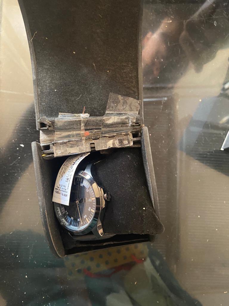 DaminiHalli's tweet photo. Love it when Myntra behaves like they send you stuff for free. 🙄 @myntra @MyntraSupport 

Broken box fixed with tape, battery lock missing, protective film missing on the dial... definitely selling used products! And this was meant to be a gift. Imagine the horror! https://t.co/EVsxkwWVKi