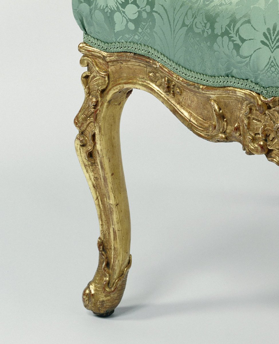 This is the cabriole leg: it's a leg shaped like an "S." The leg first curves outward and then inward, either slightly or more dramatically.