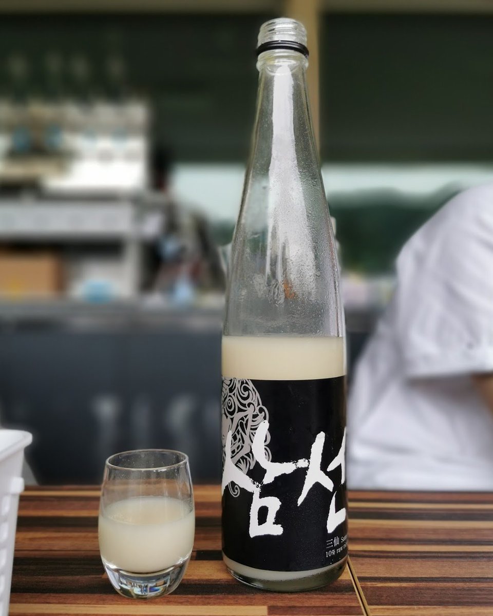 Makgeolli is the stuff at the bottom, including some of the dregs. The Sino-Korean name is takju 濁酒, or "cloudy alcohol". The alcohol content tends to be lower than cheongju, and so is the price.