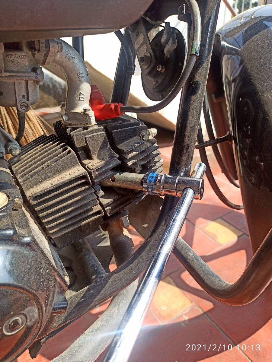 Just fit the tool and move it Counter Clock Wise to open the Spark Plug