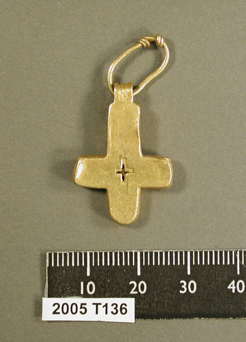 This hollow gold C7th cross pendant from Lincolnshire is perhaps the closest parallel to ours, though ours is notably different being being solid and more...vernacular form, but it perhaps hints at what the lost attachment may have looked like