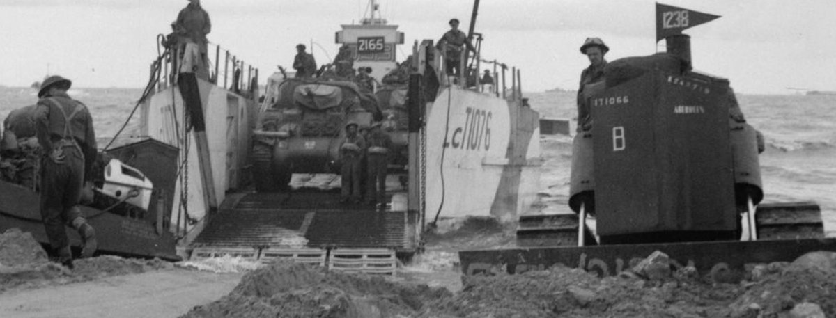 Recognise the bulldozer? It's the one we saw on the ramp of LCT 858 not long ago, with its LTIN on the blade. Meanwhile the tank and LCT crews patiently wait. Actually it's probably not very patiently at all...