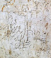 Une caricature très ancienne de la crucifixion de Jésus, ayant une tête d'âne (graffiti d'Alexamenos, dessiné entre le Ier siècle et le IIIe siècle)