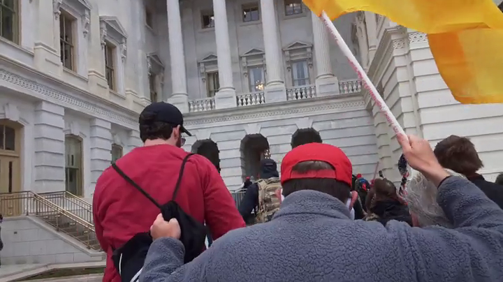 rocketman2001's tweet photo. More shots of #GreyFleeceGadsdenFlag &amp; #BetaKappaMaga approaching the NW plaza door from Parler video StkJb205ViGR. @capitolhunters @SeditionHunters @SeditionData @ParlerVideos https://t.co/T57qqBAIys