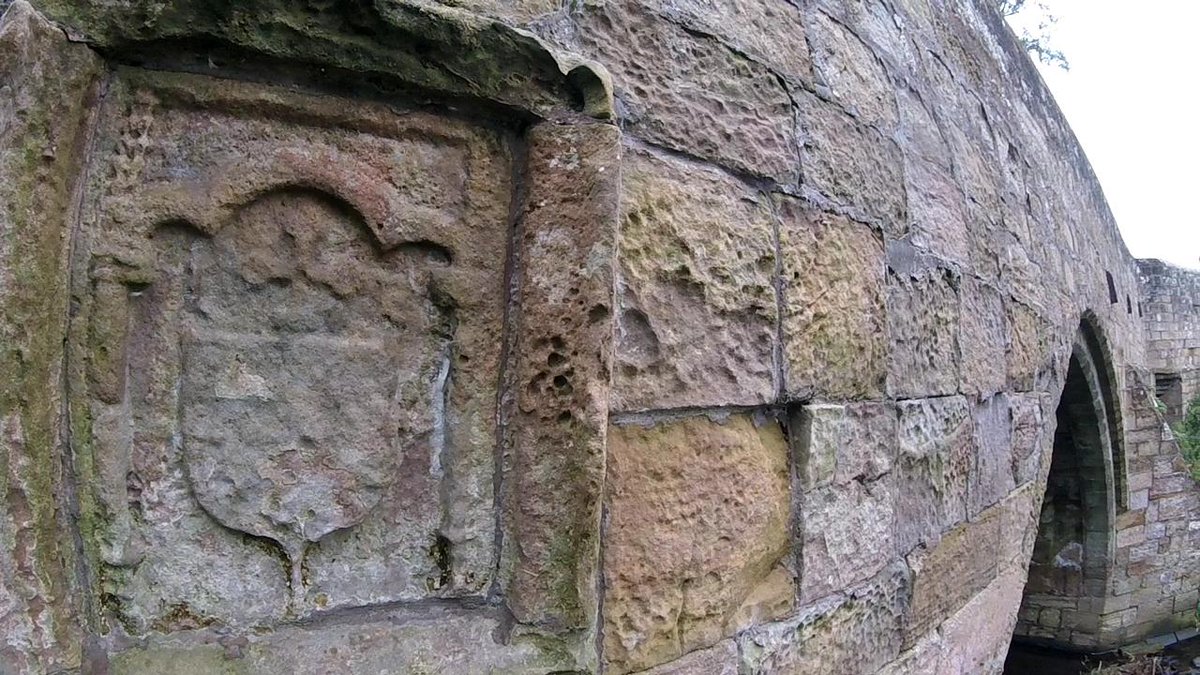 The bridge contains, what is described as an illegible armorial panel on the east elevation. In 1895, Alexander Millar identifies the panel as belonging to Archbishop, James Beaton.
