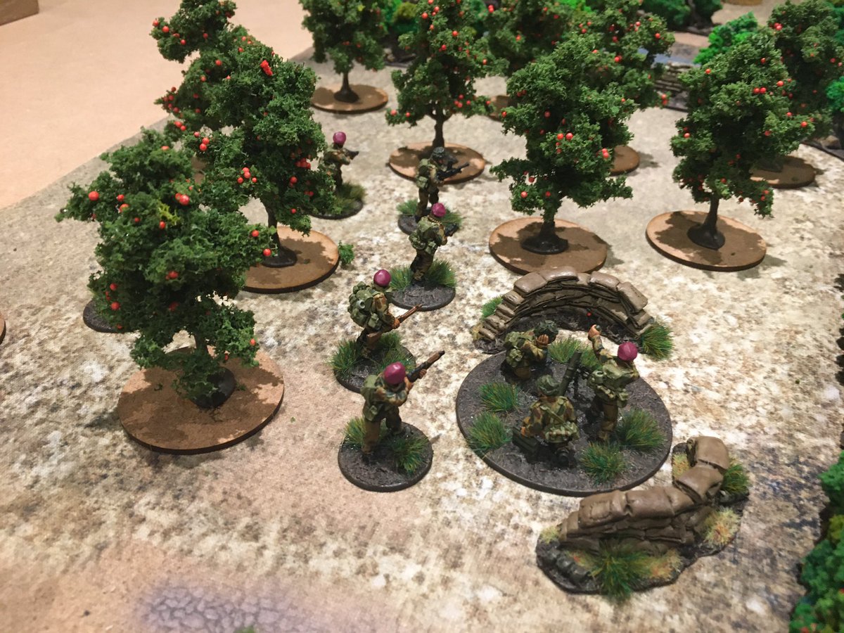 A British Parachute section deployed in support of the 3” mortar in the orchard, advanced forward taking the fight to the Germans. Occupying a forward ditchline for the advantage of heavy cover, then allied to their sustained, rapid small arms fire brutally halted the Germans.