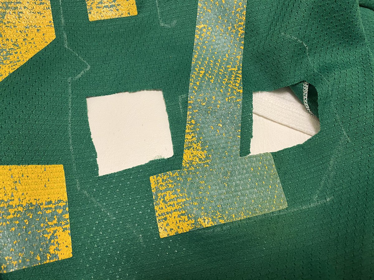 So what I did was graft some of the original fabric to where the holes in the 8 are, otherwise the original 7 would show through. I patched the holes with a lighter green fabric. When the 8 was sewn in place, it looks stock. I used chalk to mark the 8.