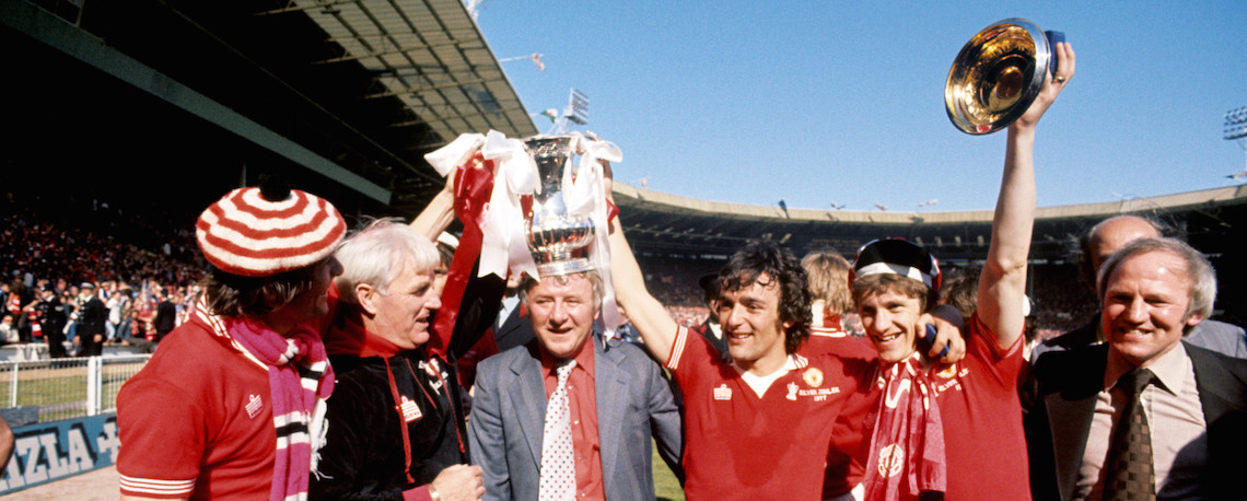 In 1977, led by manager Tommy Docherty, Manchester United who had regained promotion to the First Division in 1975, reached a second consecutive FA Cup Final. Where they defeated bitter rivals Liverpool 2-1 denying them an historic Treble. This was a classic United performance.
