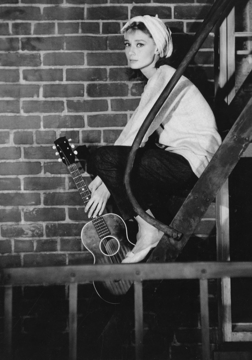 Happy #GetOutYourGuitarDay! 🎸⠀⠀
⠀⠀
Audrey Hepburn photographed during the production of Breakfast at Tiffany's, 1961