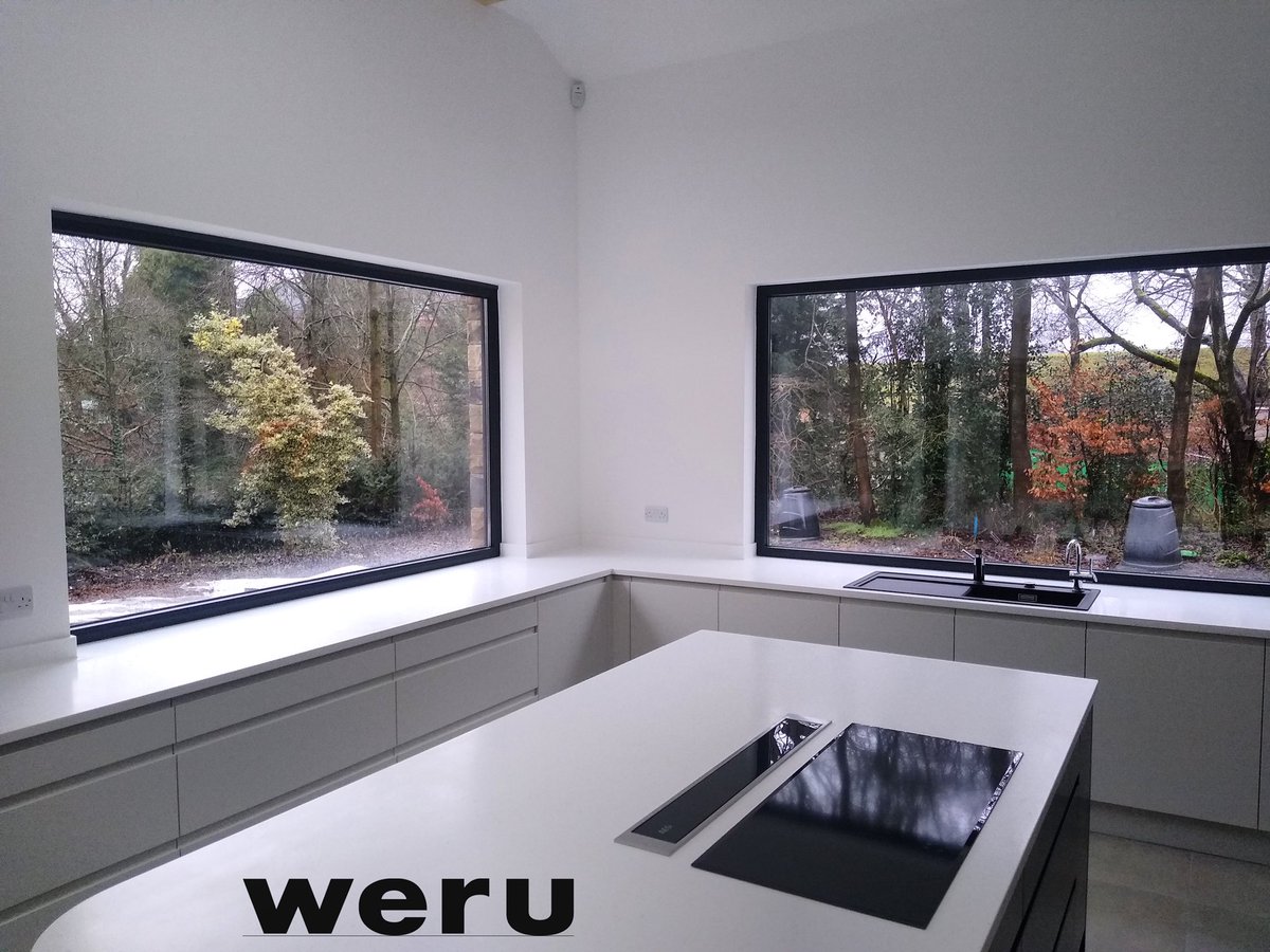 WeruWindows's tweet photo. Simply stunning! Our Afino Tec windows working in synergy with the bespoke #corian worktop to provide picture perfect views in this dual aspect #kitchen design https://t.co/YwMHDcO5i2