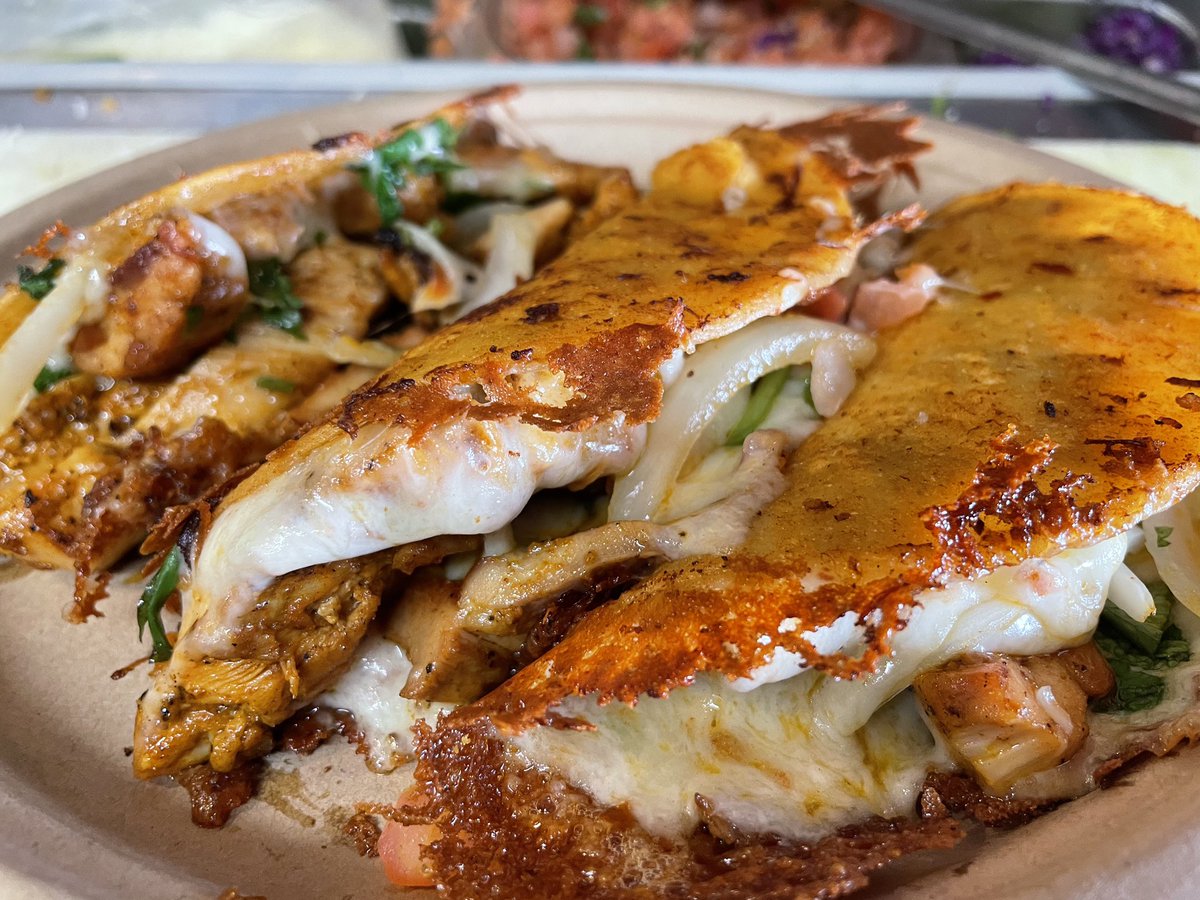 Los Gallos Rojos. Our spicy marinated chicken swimming and melted cheese, pico de gallo, onions and cilantro. Take your tastebuds for a ride and see if you can catch the red rooster. #pollo #gallo #rojo #taco