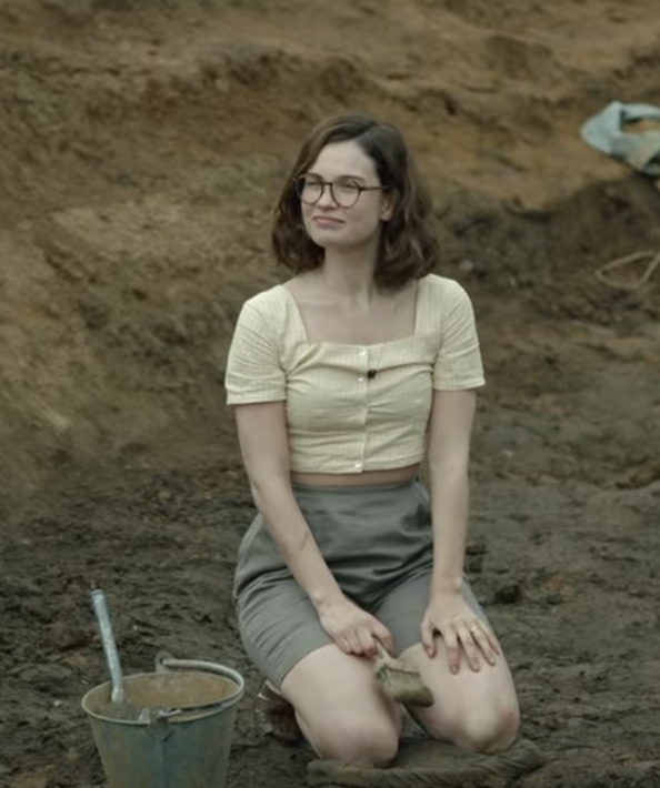 I wouldn't let her anywhere near my archaeological site dressed like that.Looks a bit off.On the right one confirmed and one possible photo of the real Peggy at the site in 1939.Much more practical and conservative clothing, perhaps not sexy enough for Netflix?