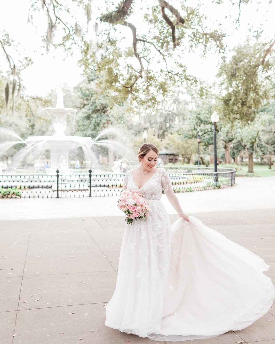 If you know me at all, you know I’m literally obsessed with every single inch of this photo. The magical light, the lovely colors, the whimsical tone, the dreamy long sleeved dress, the glowing bride, the always perfect Forsyth fountain, the flowing train and the romantic vibe.