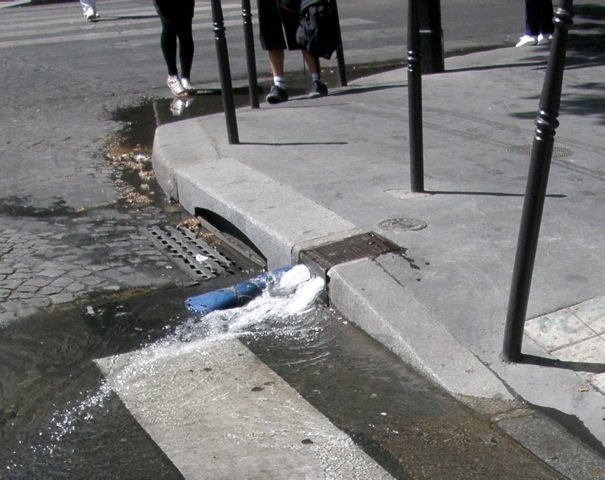 Visitors will often notice (well I do cos I'm weird) water running down the gutters gushing from what might look like water leaks. They are in fact deliberate, directed by a roll of old rug the street cleaners carry