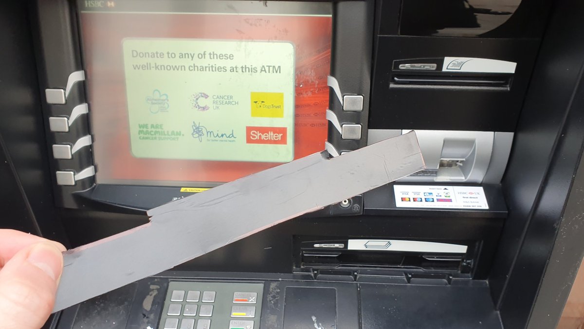Realised someone had stuck a whole fake cash door on the front, and the cash was actually stuck to the back of the fake door.A neat design: a bit to stick it to the machine, and an ultra-sticky section that the notes attach to, so the machine can't pull them back in.