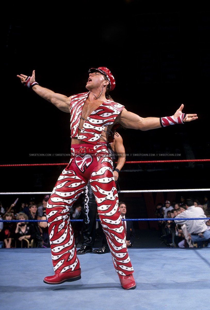 Number 4, it's the Heartbreak Kid, Shawn Michaels!He's wearing his red and white stripes a la Atletico Madrid.