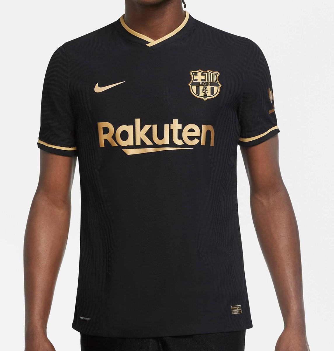 Number 9 is the powerhouse of the Hurt Business, Bobby Lashley!His sophisticated black and gold attire is matched by Barcelona's away shirt from this season