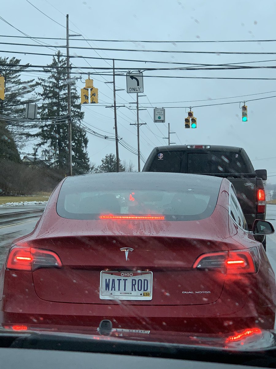 Tesla with a “WATT ROD” license plate. That’s funny.