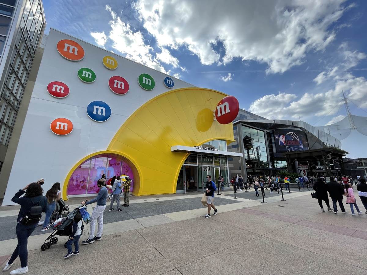 laughingplace's tweet photo. The new #MMsWorld location at #DisneySprings has opened their doors for guests to satisfy their sweet tooth and get their hands on some delicious memorabilia: https://t.co/Mg3adK86j7 https://t.co/fCzQq81pcX