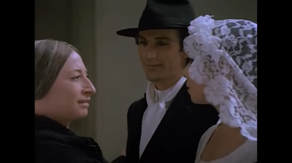 And his Mother (who appears to be younger than him and wears less make-up) …