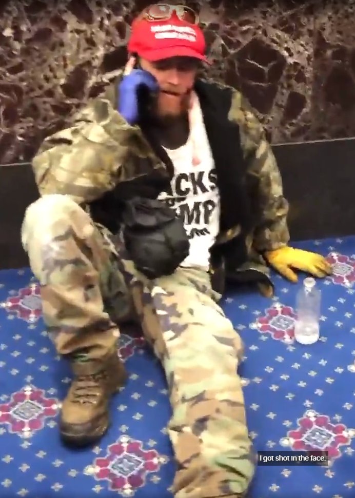 9/ Next on the field by 12:53:50 is this guy in camo top and pants with a red hat and string bag on his back. I believe this is Joshua Black, who was wounded in his cheek by a nonlethal round and photographed bleeding in the senate. Later arrested.  https://www.wsfa.com/2021/01/14/leeds-man-charged-capitol-riot-identified-by-blood-his-cheek