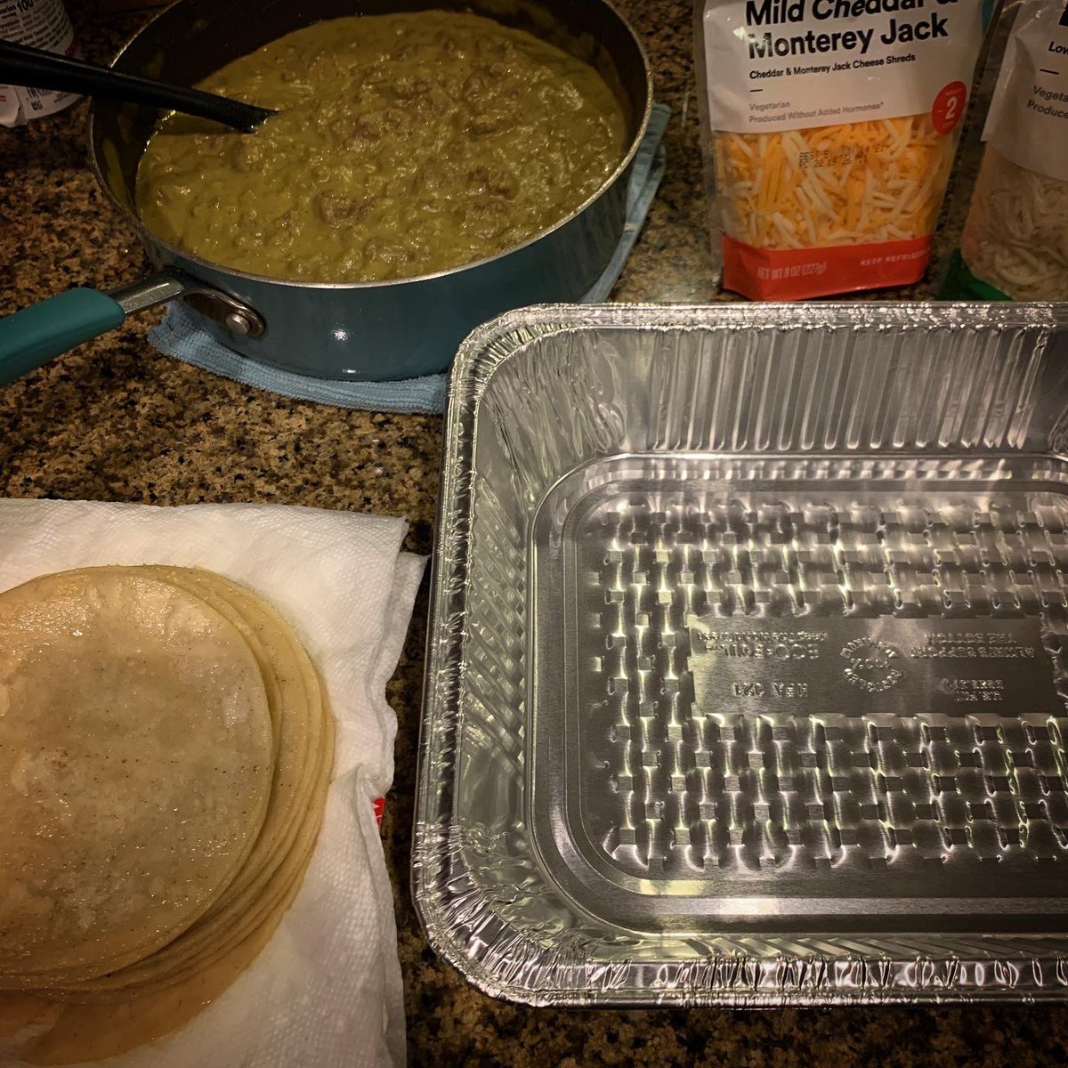 vanessa_ramirez's tweet photo. After a couple of delays(like singeing the peppers beyond edible), I finally got these enchiladas done. Will cook them up and have some tomorrow then freeze these in portions for days when I need a little comfort food. #makingthethings #learningmymommasfood https://t.co/sJmwj0ESW2