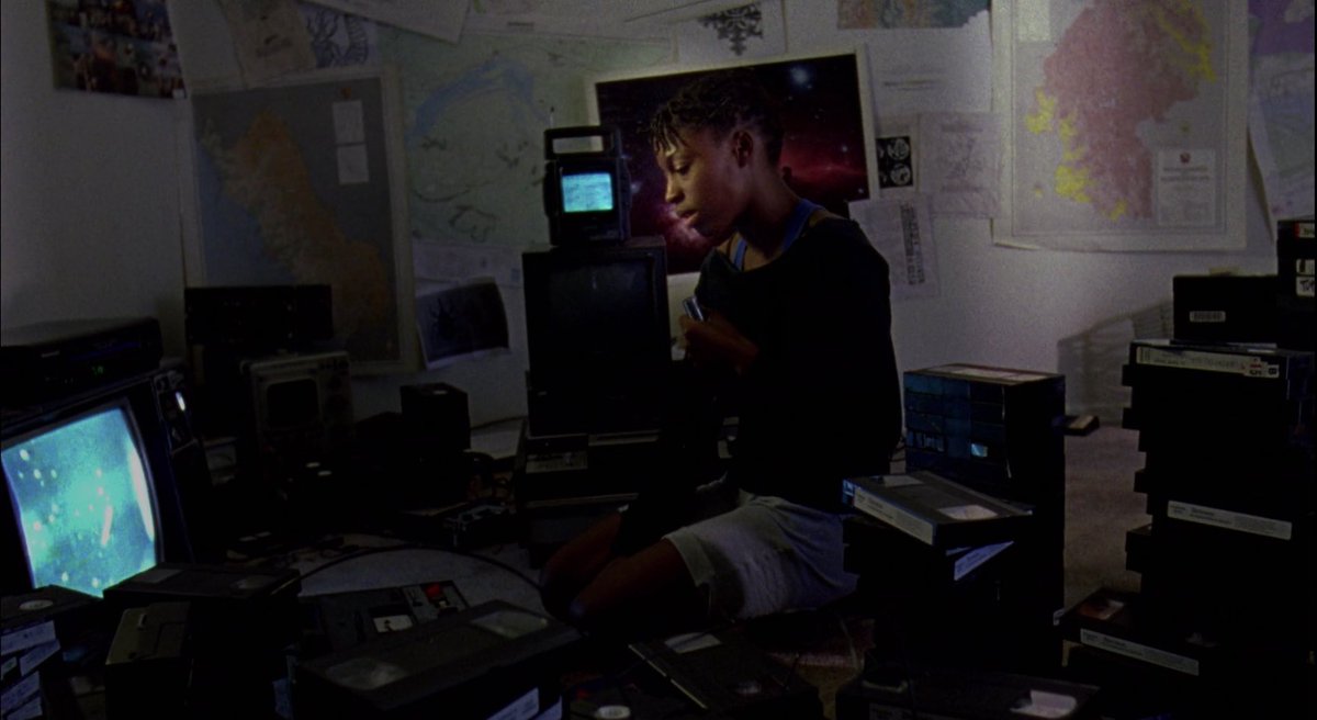 DARK MATTERS (2010) dir. Monique WaltonA woman obsessed with UFOs comes to terms with her identity after a visitor makes her question her ethnic, cultural, and planetary origins.  https://www.criterionchannel.com/dark-matters&nbsp;