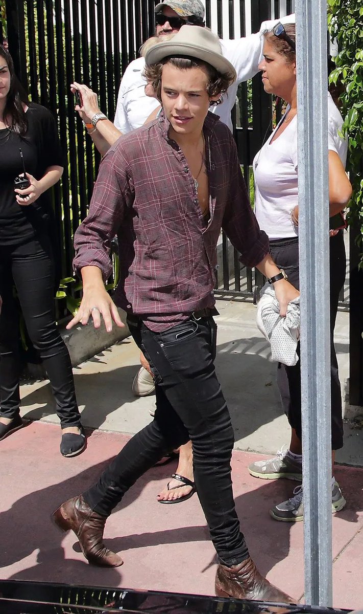 Saint Laurent boots and skinny jeans, combined with a headscarf or wide-brimmed hat were Harry's go to, all enhanced by his scrapbook-esque collection of tattoos:  https://trib.al/RXJhPJT 