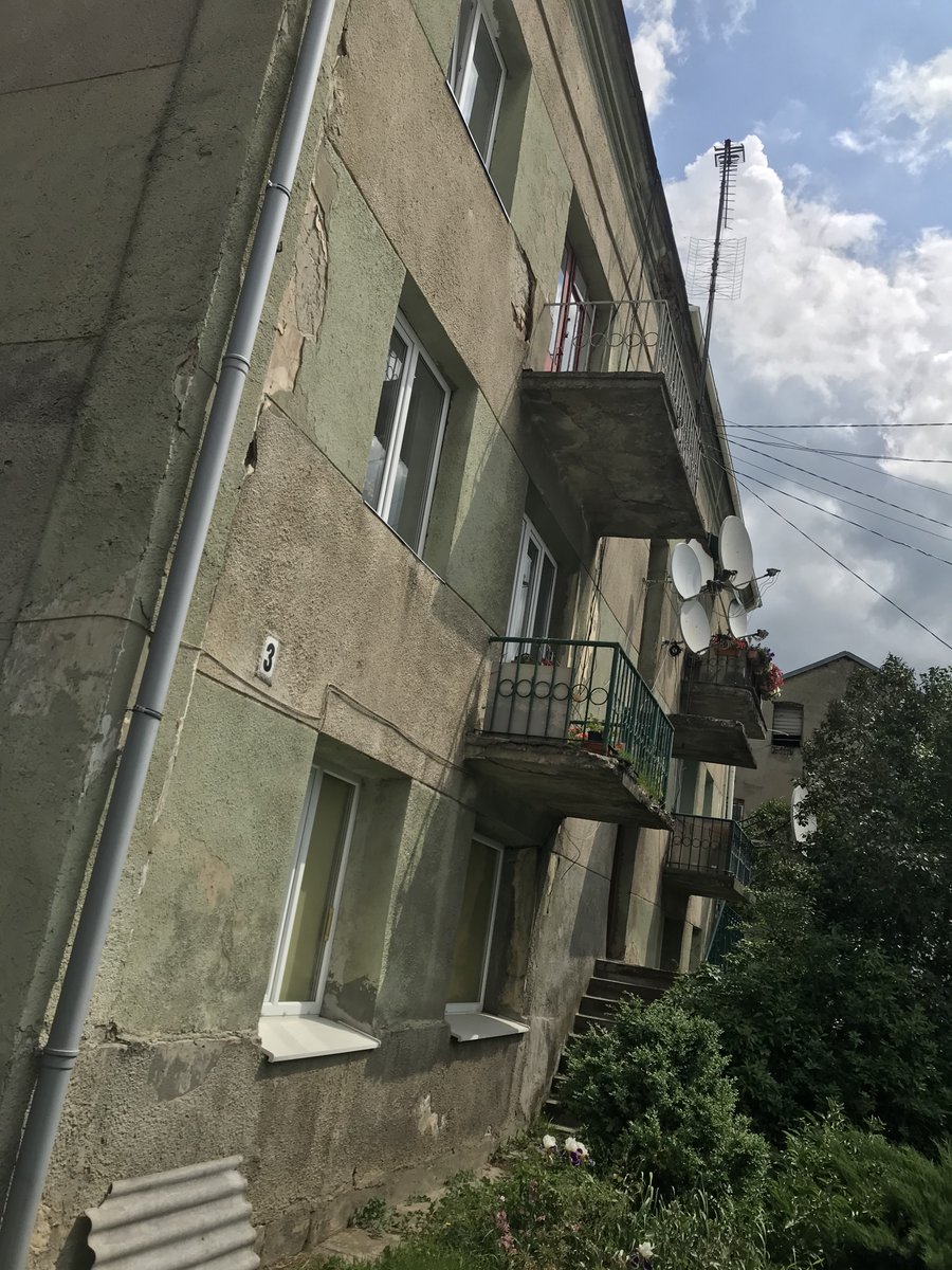 The house was gone but the town's layout was unchanged. With the help of a tour guide I visited the house's location, beside a marketplace -- now a park -- where my ancestors had been traders. The old synagogue (pictured, now flats) still stood nearby. I had a good look around.