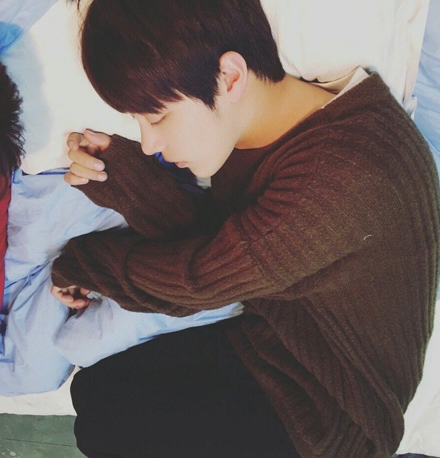 he sleeps like a cat with his kitty paws