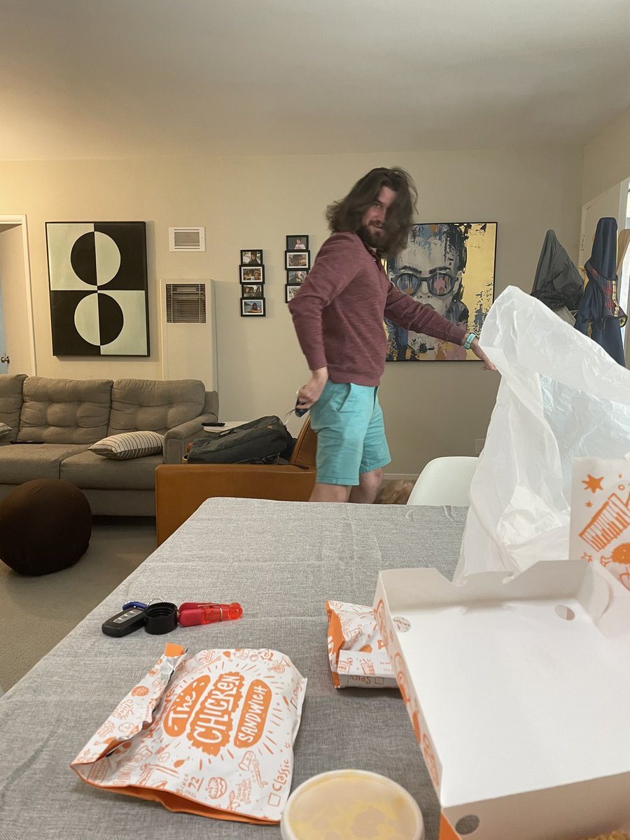 Fellow  @PopeyesChicken virgin  @wpschwarz has arrived and digging into the famous sandwich.