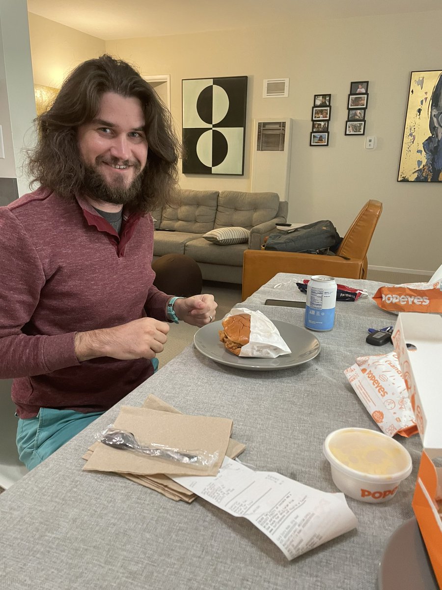 Fellow  @PopeyesChicken virgin  @wpschwarz has arrived and digging into the famous sandwich.