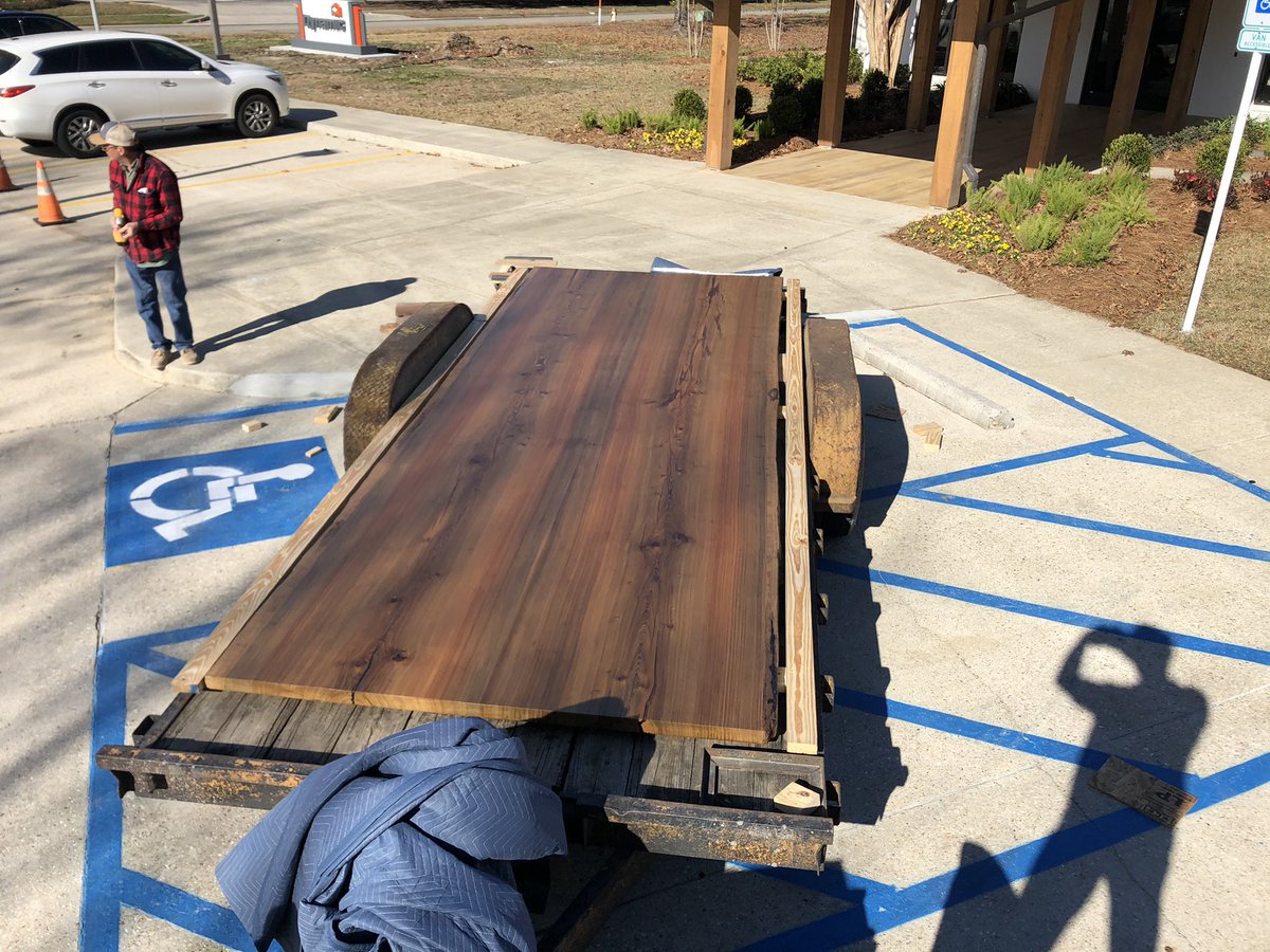 You know it’s a huge table when it covers the entire trailer you are hauling it on 😳 this is the conference table we posted last week  #logging  #swamplogging #rivertable #cypress #sinkercypress #sawmill #liveedge #liveedgewood #liveedgetable #liveedgeslab #liveedgefurniture