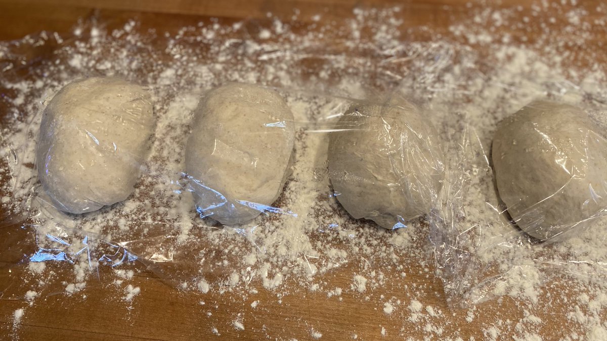 Take each 350g chunk and make little oblong balls like these. Stretch the top over and tuck the bottom underneath. Set them on the floured runway you made earlier, and re-use the plastic to cover so you feel less guilty. Save the remaining dough for next time. See?!