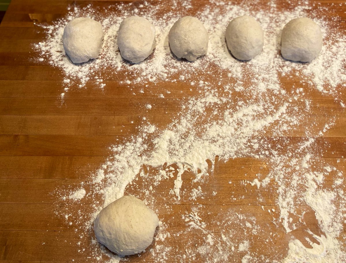 Take each 350g chunk and make little oblong balls like these. Stretch the top over and tuck the bottom underneath. Set them on the floured runway you made earlier, and re-use the plastic to cover so you feel less guilty. Save the remaining dough for next time. See?!